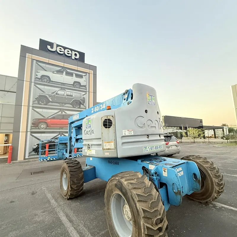 GTA Equipment Rentals lift working the facade of a car dealership