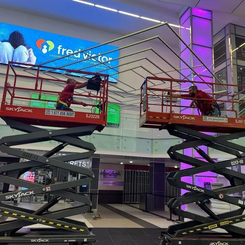 GTA Equipment Rentals scissor lifts working inside a GTA shopping mall